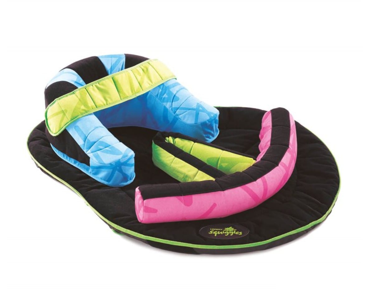 Prone positioning support with padded coloured rolls on a soft base