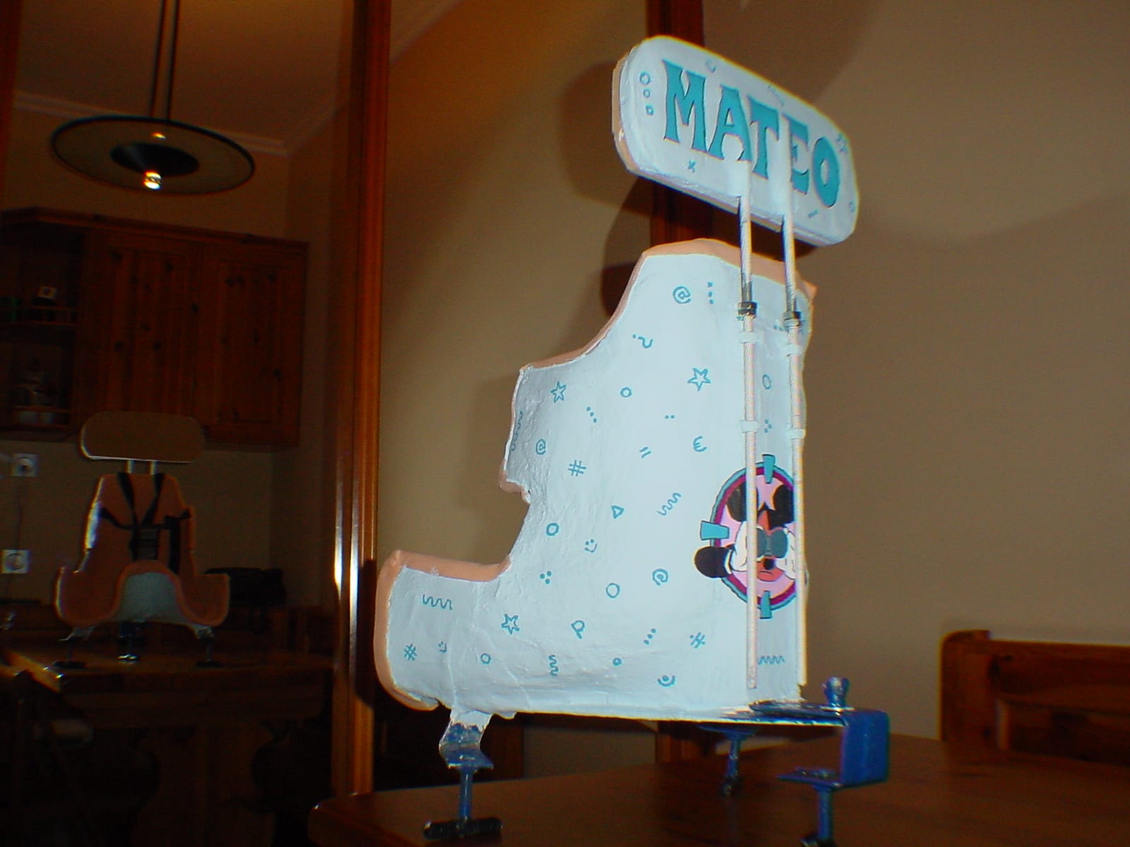 Custom-moulded pelvic seat, decorated and fitted to a swing at home