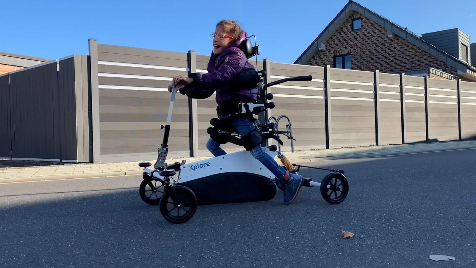 A girl moves along the street with the Xplore